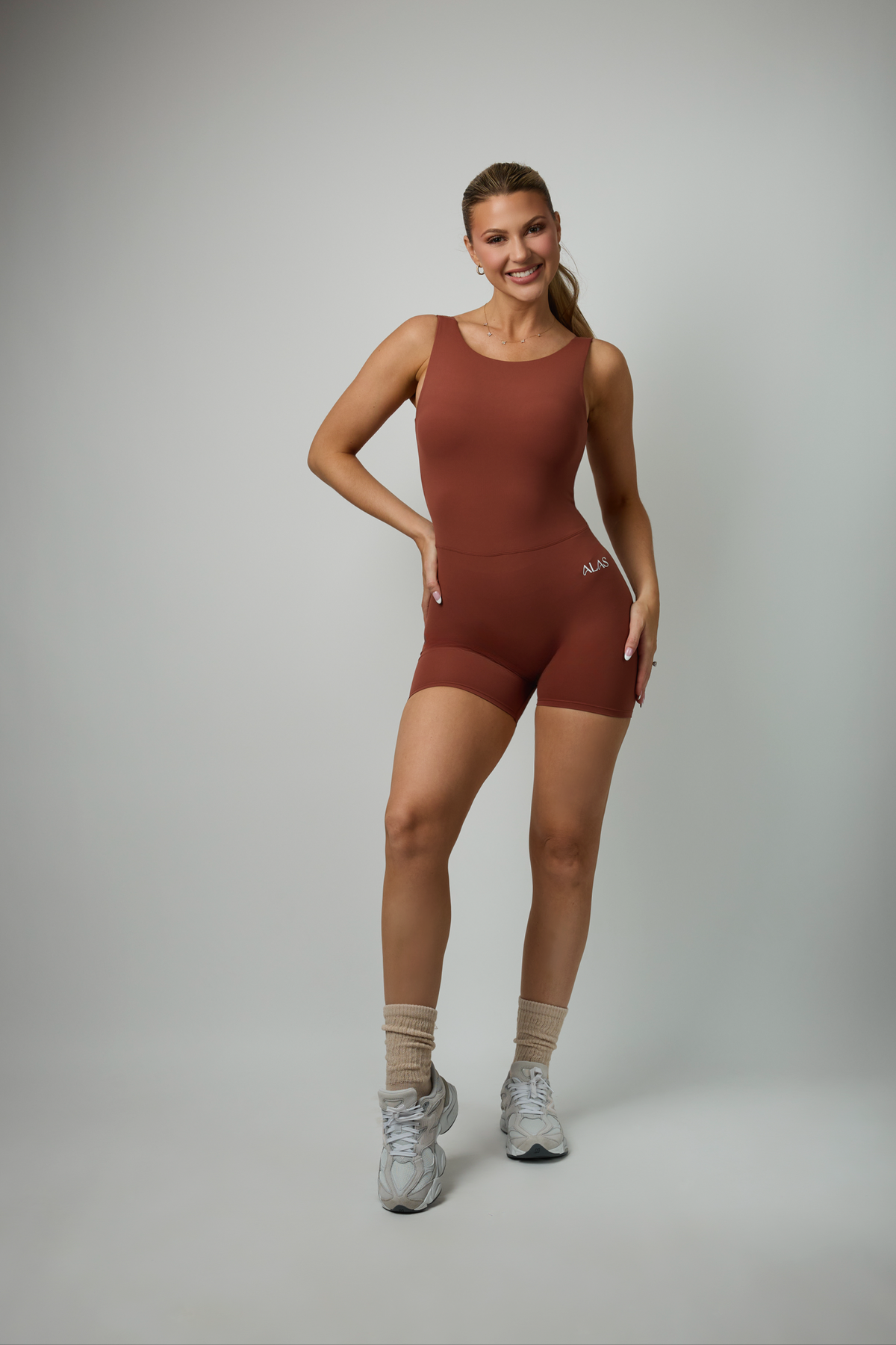 MUSE ROMPER – Rust Color Open-Back Biker Romper